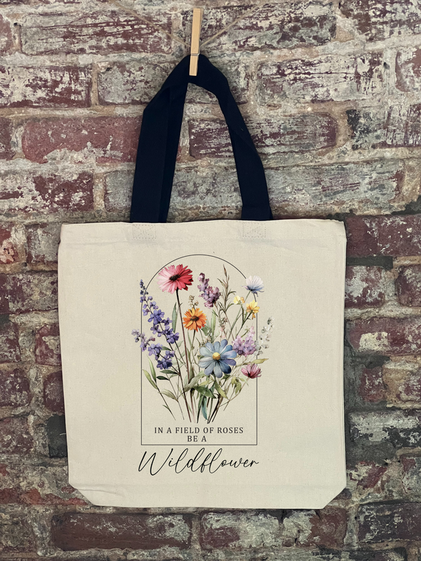 In a Field of Roses Be a Wildflower Canvas Bag